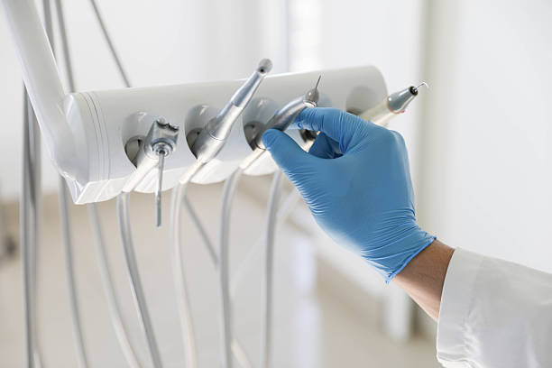 Professional Emergency Dentist technician working in Okauchee Lake, WI